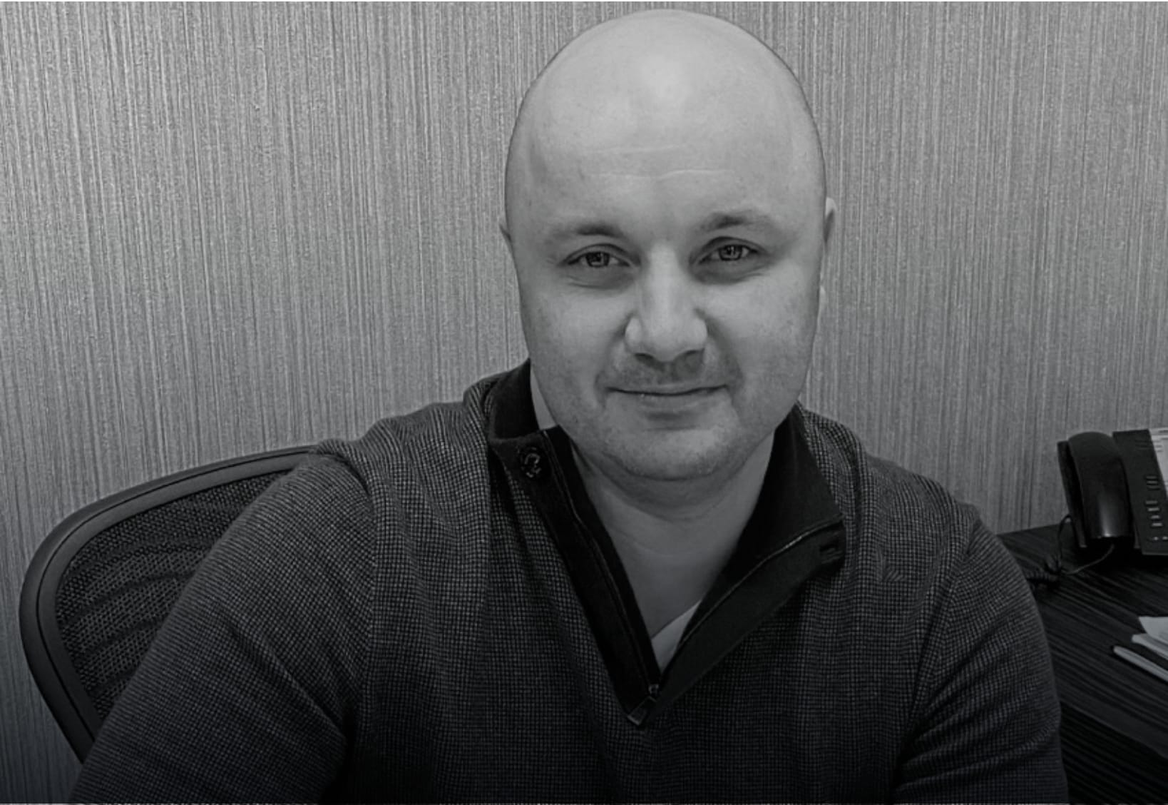 Aleksandr, CEO and Co-founder of NYWD in his office